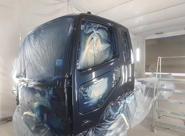Black truck being repaired and spray painted — Castledine's Truck Painting & Repairs in Fountaindale, NSW