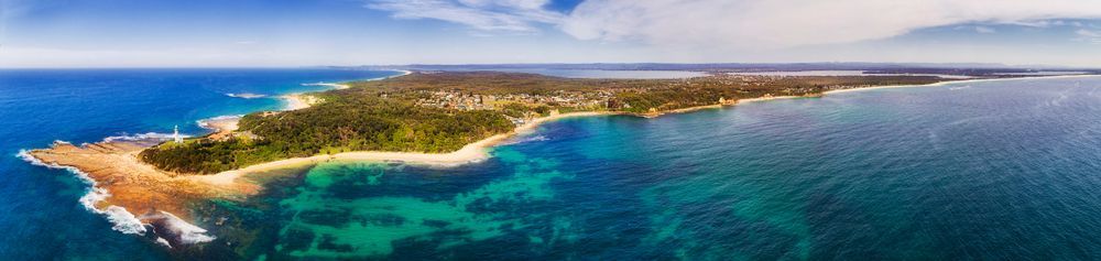 An Aerial View Of A Small Island In The Middle Of The Ocean  — Castledine's Truck Painting & Repairs in Tuggerah, NSW
