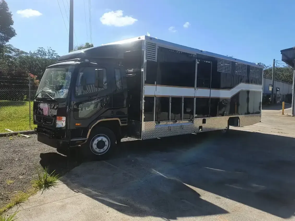 Black truck recently repaired parked outside - Castledine's Truck Painting & Repairs in Fountaindale, NSW