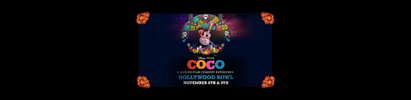 Coco movie poster at Hollywood Bowl: Characters, colorful, dark blue background. Orange accents.