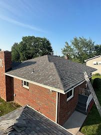 Red House with Bricked Roof — Erie, PA — Advanced Roofing and Construction