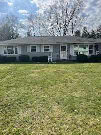 Front House with Garage Doors — Erie, PA — Advanced Roofing and Construction
