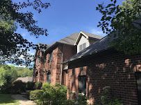 Red House with Bricked Roof 3 — Erie, PA — Advanced Roofing and Construction