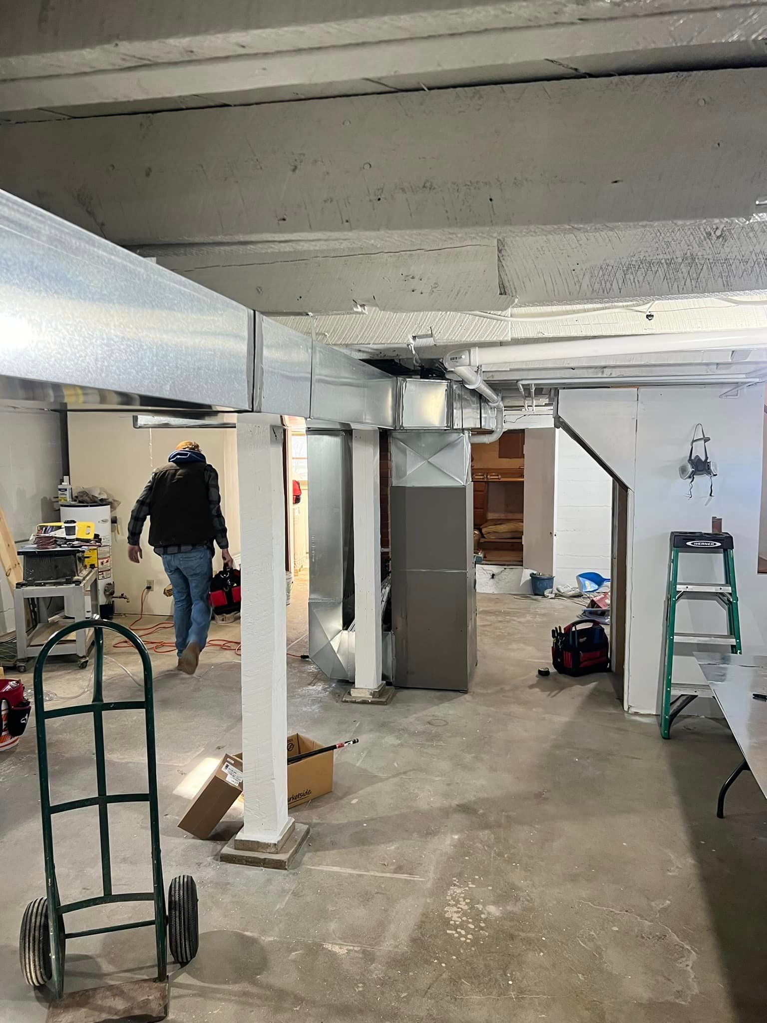 Man Standing in A Room with A Cart and A Ladder | Sullivan, MO | Williams heating and cooling