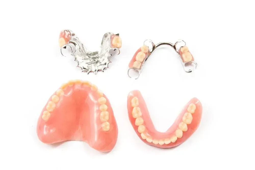 There Are Three Different Types of Dentures on a White Background — Twin Towns Denture Clinic In Laurieton, NSW