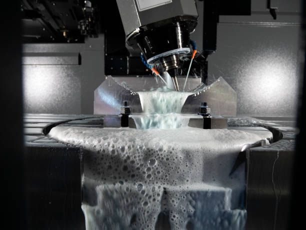 CNC machine cutting metal, spraying coolant.