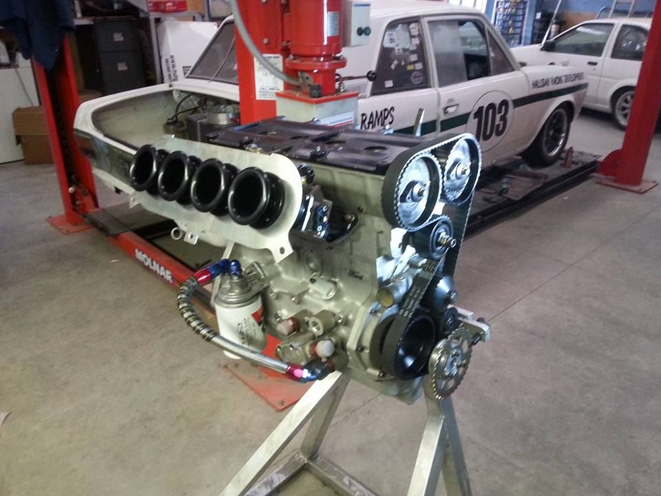 A car with the number 103 on the side of it.