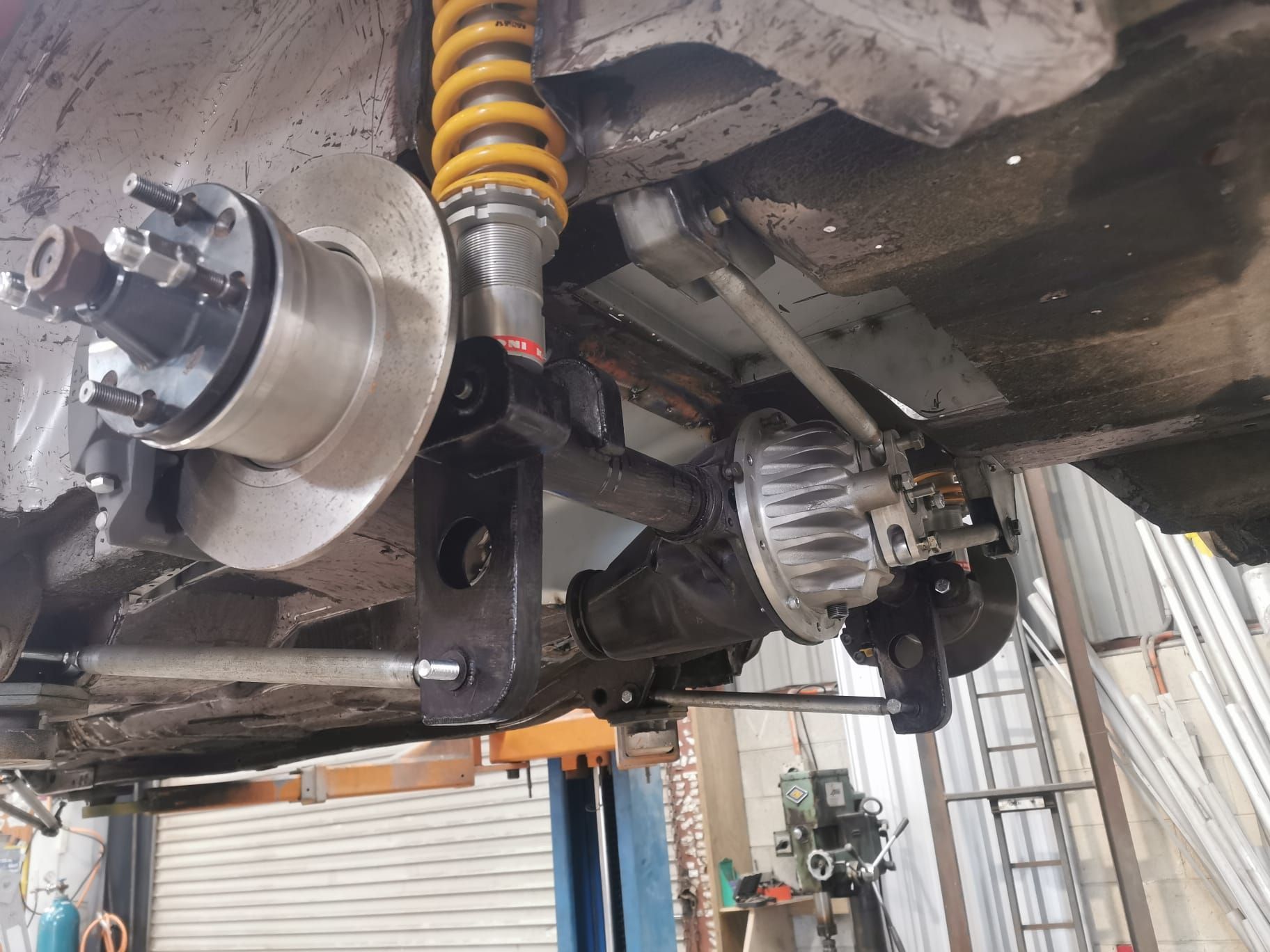 The underside of a car with a clutch and steering wheel.