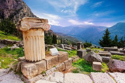 Traveller reviewing important information for a Delphi day trip from Athens