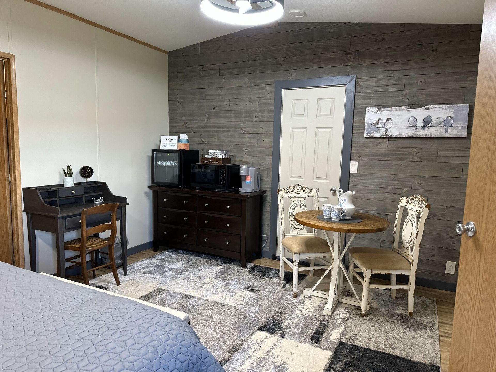 There is a table and chairs in the room.