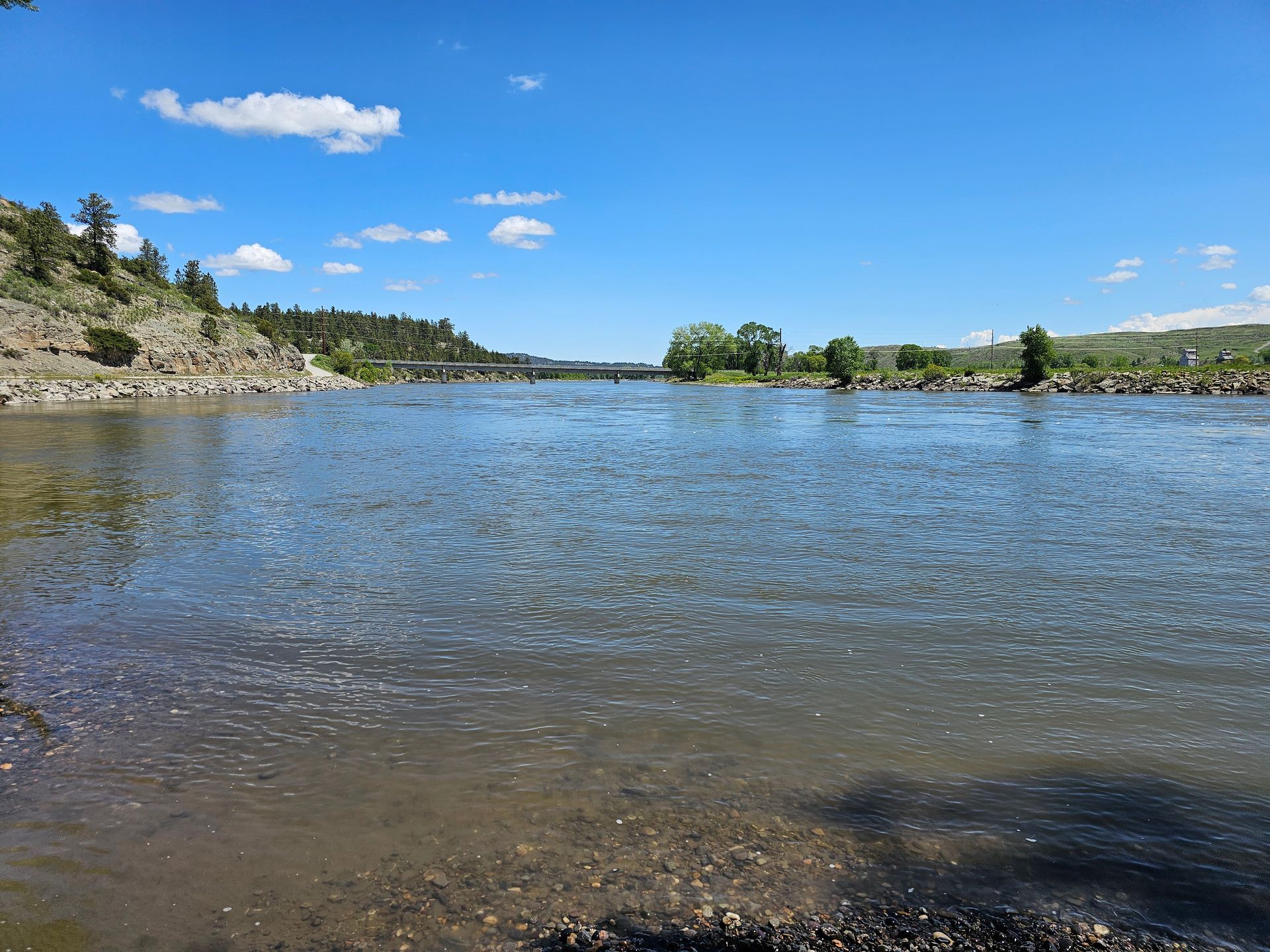 A large body of water with a bridge in the distance