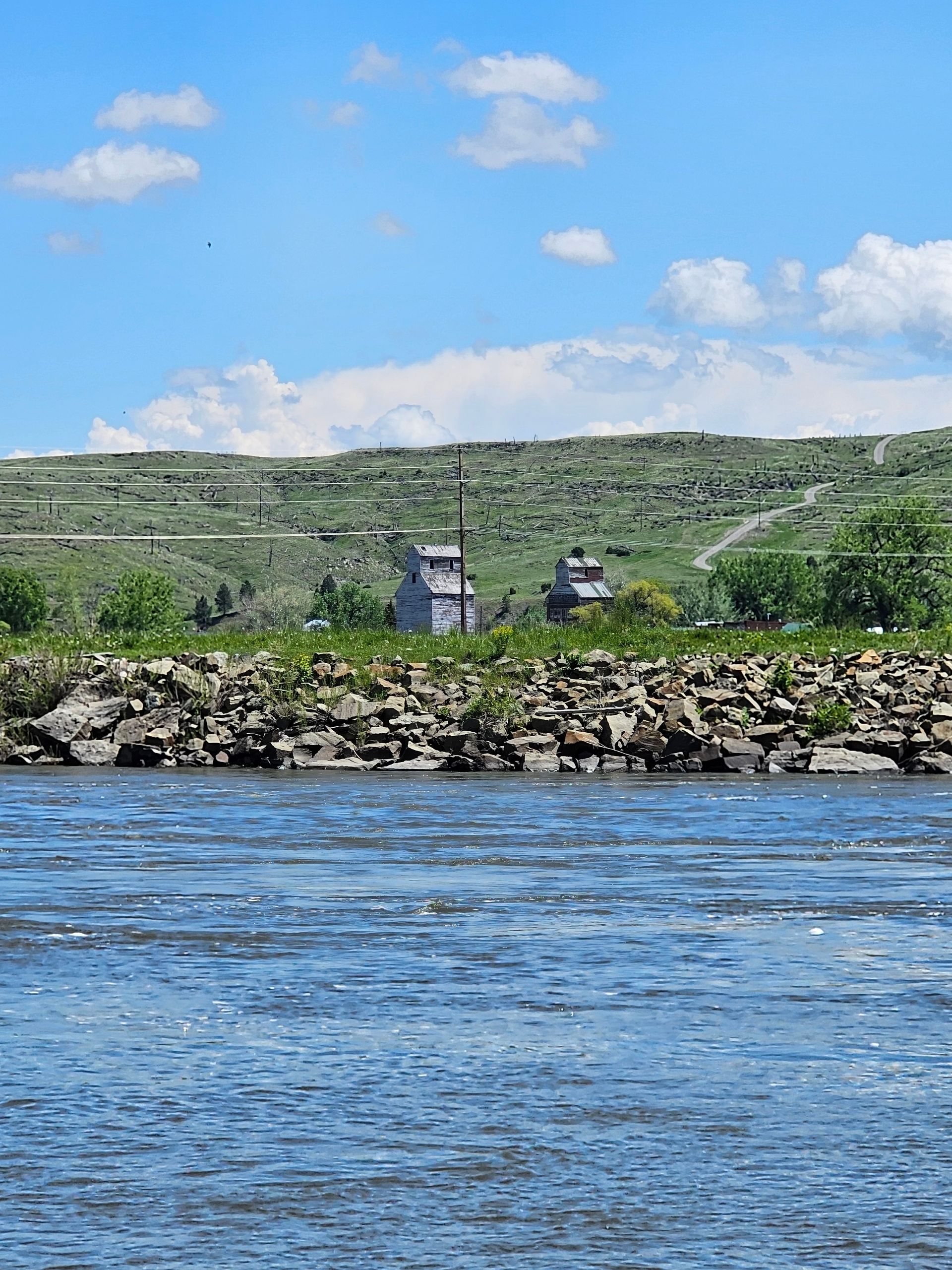A large body of water with a house in the background