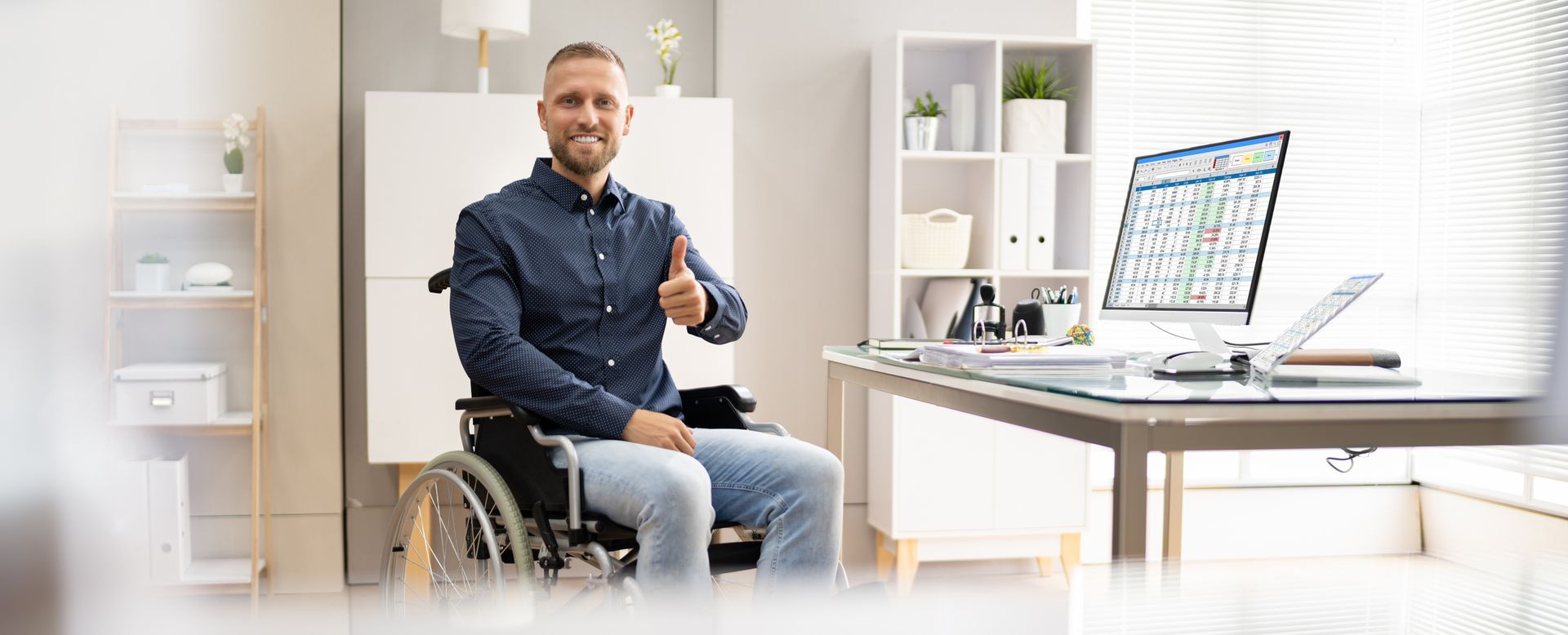 Happy Young Business Worker With Disability Using Computer | Durant, OK 