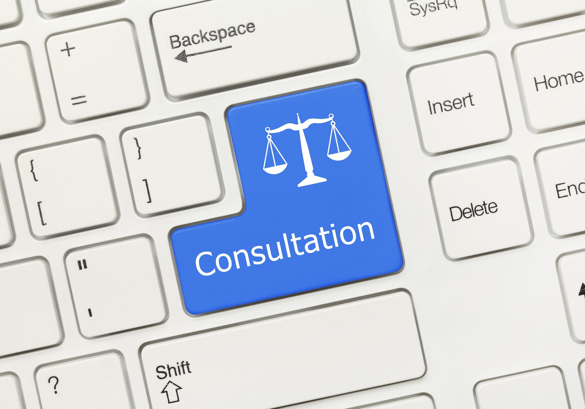 White keyboard highlighting blue law key for social security disability claim concept.