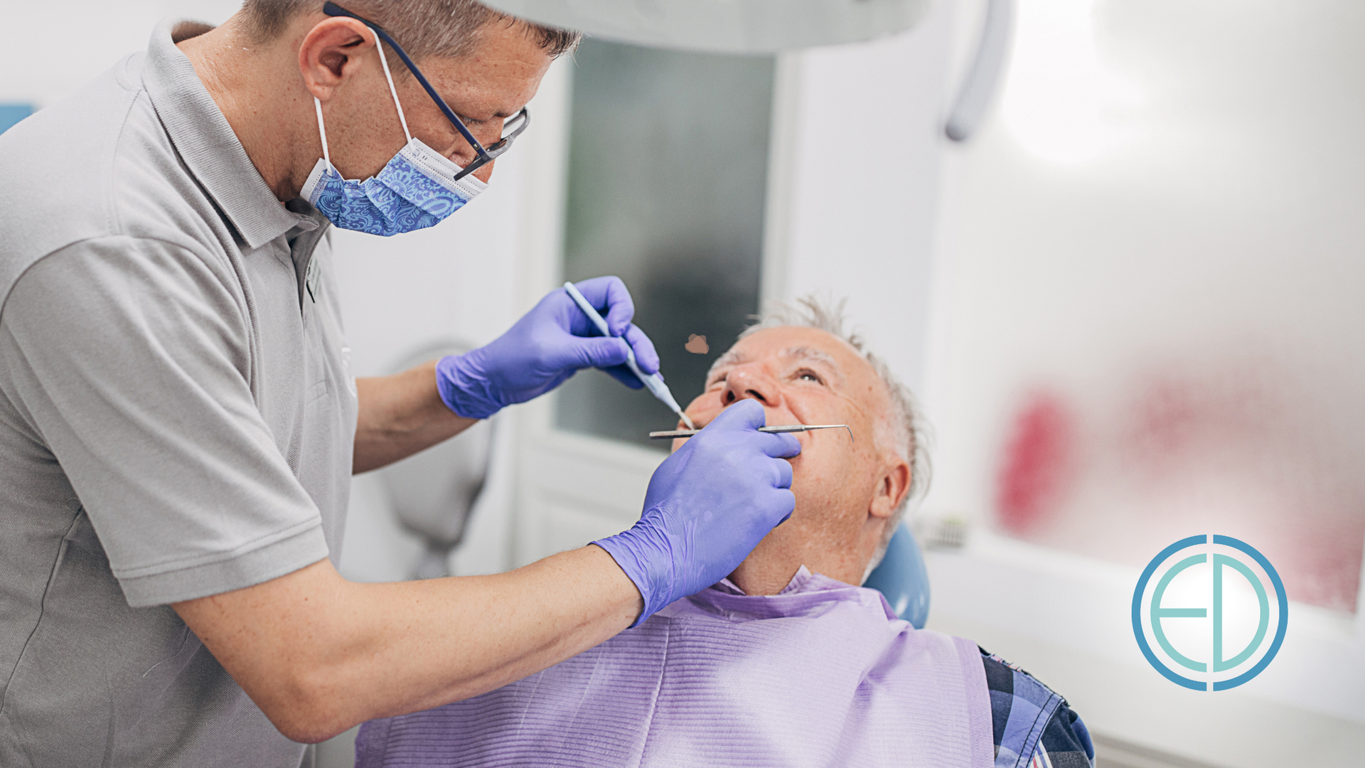 Dentist in mask and gloves examining elderly patient's teeth in a clinic.