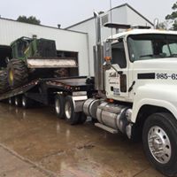Emergency Towing — Tow Truck Towing a Broken Down Car in  Mandeville, LA