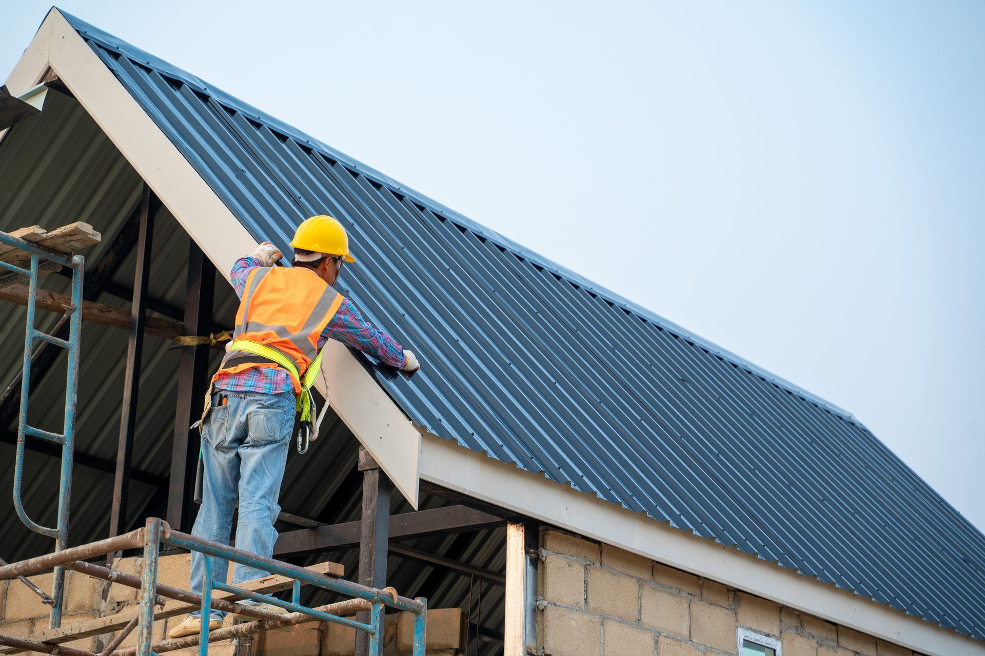 A person gloves on a roof for a roof Commercial Roofing Inspection Contractor A person gloves on a roof for a roof Commercial Roofing Inspection Contractor