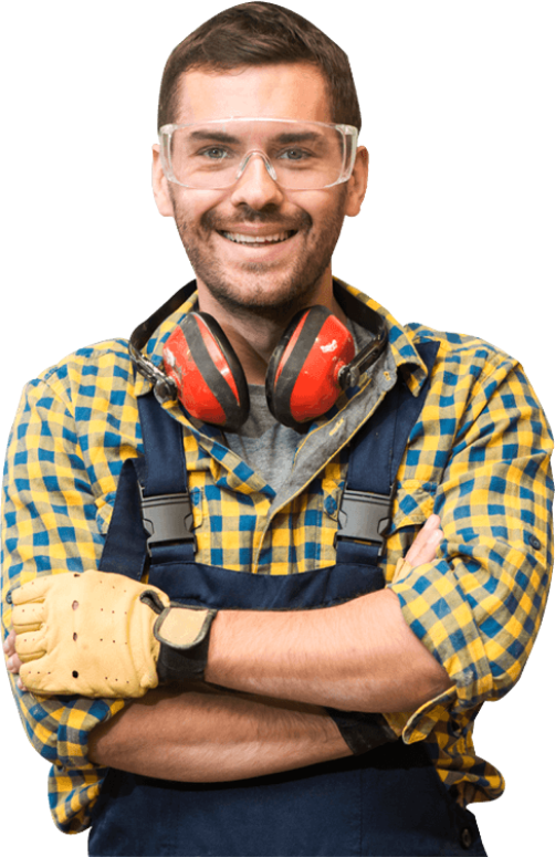 A man wearing a plaid shirt , overalls , ear muffs and goggles is smiling.