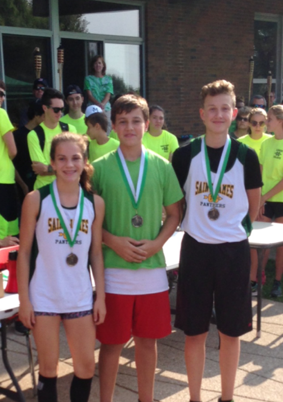 A group of young people wearing medals and shirts with the word eagles on them