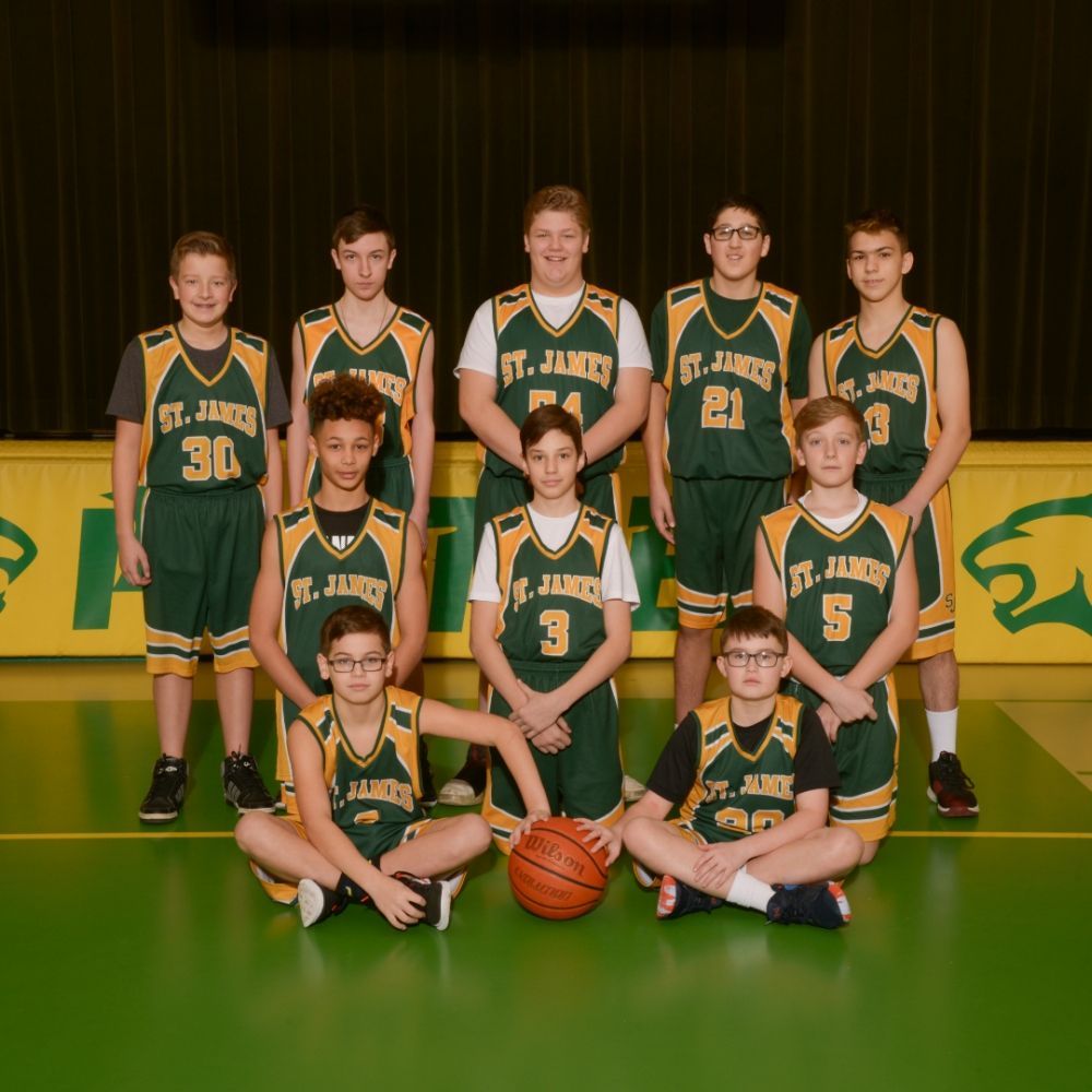 A group of st. james basketball players pose for a picture