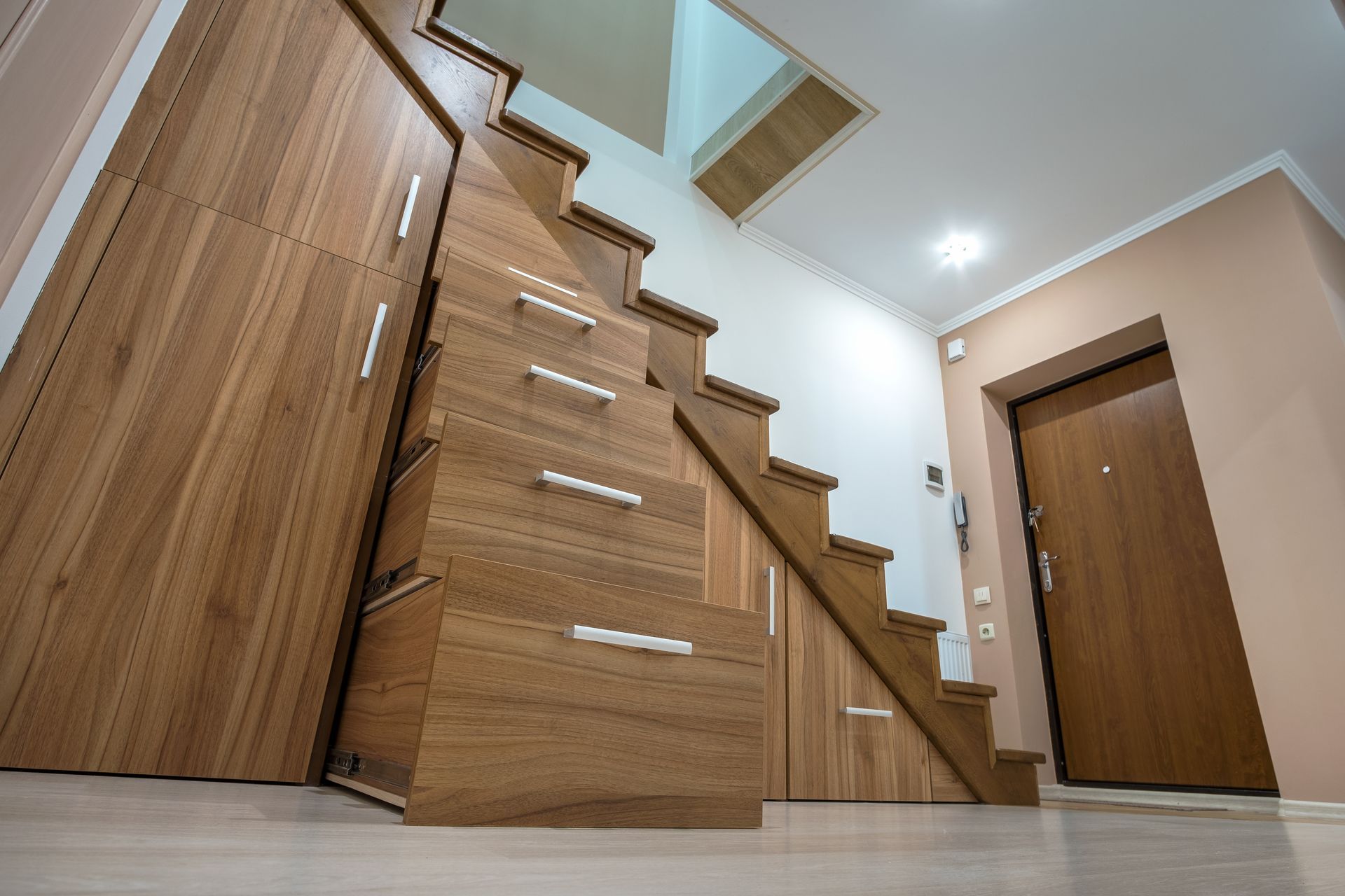 Storage cabinets conveniently located under the stairs