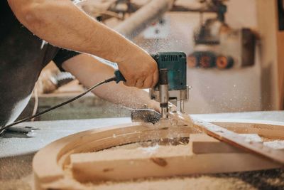 A man building cabinetry