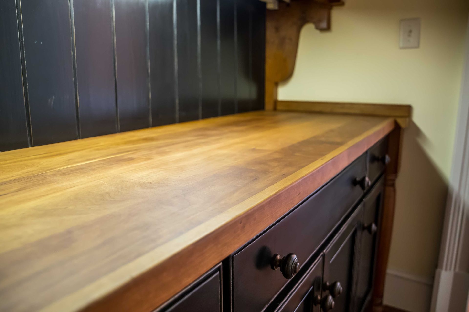 A project featuring cabinet doors painted a dark brown color