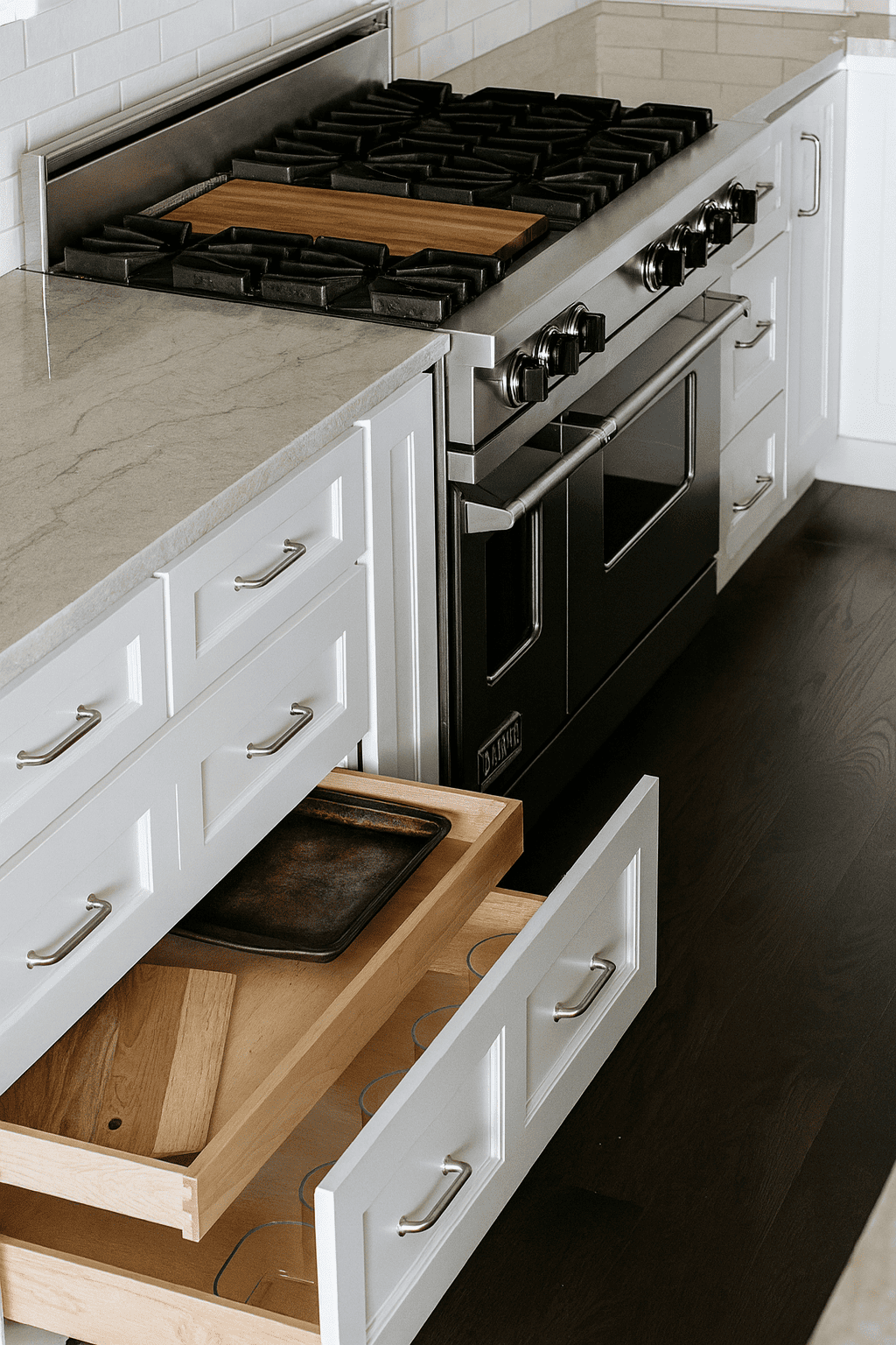 A man spraying a piece of wood with stain