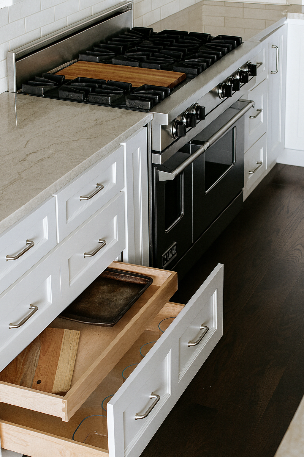 a person closing new cabinets