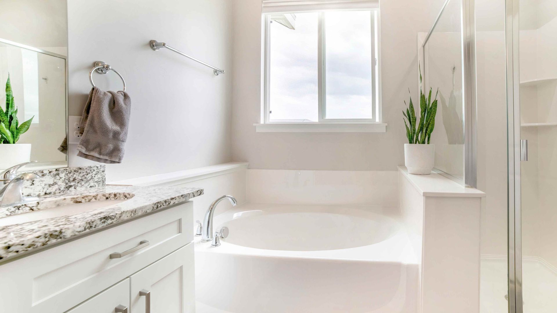 White bathroom vanity cabinets in a bathroom