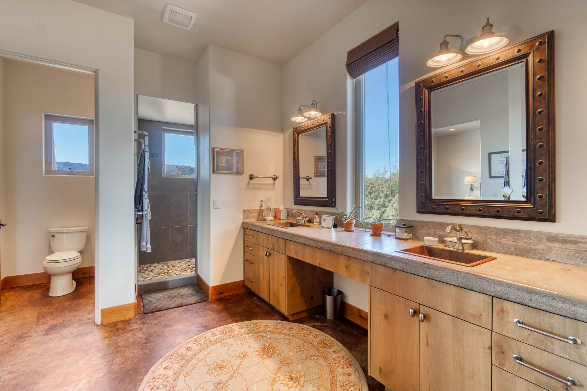 A wood colored bathroom vanity in a Longmont, Colorado bathroom