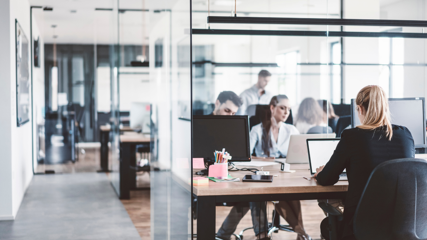 A group of tall buildings with a blue sky in the background