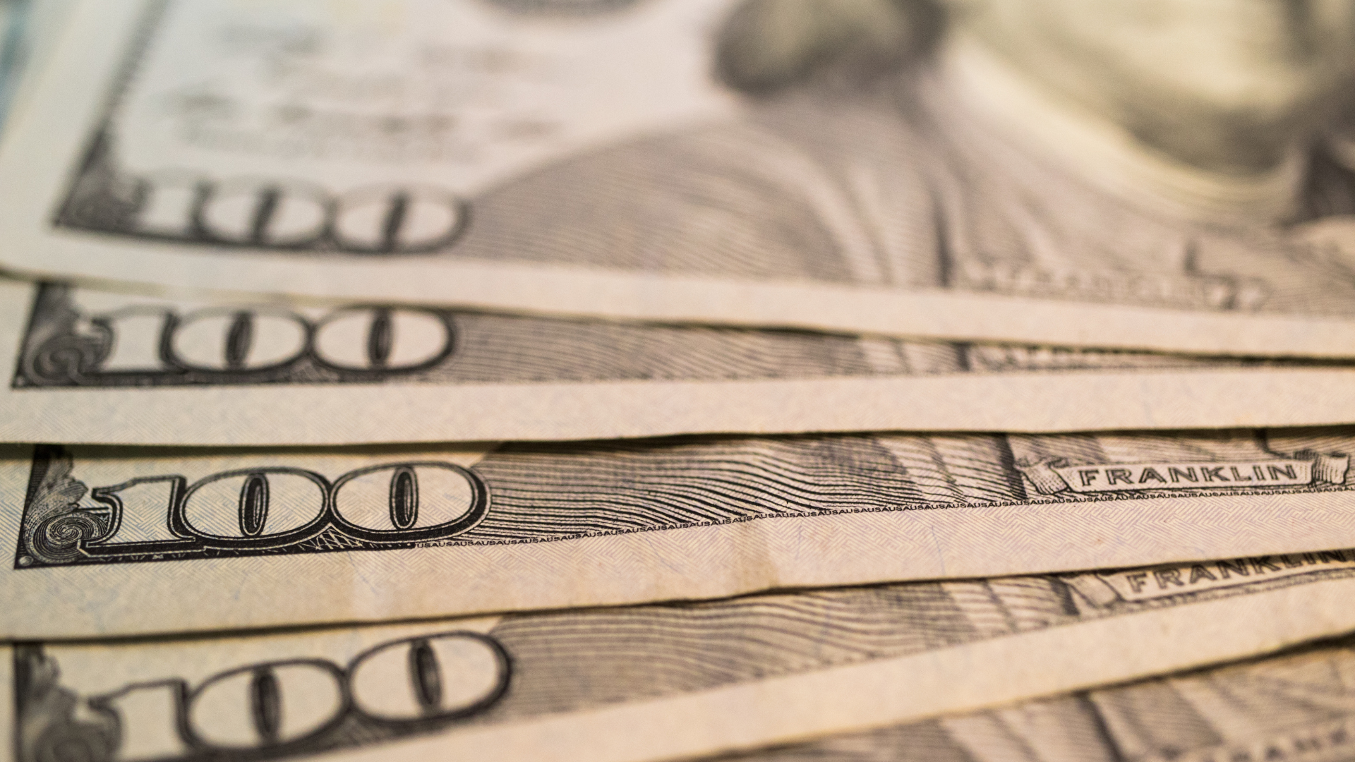 A group of tall buildings with a blue sky in the background