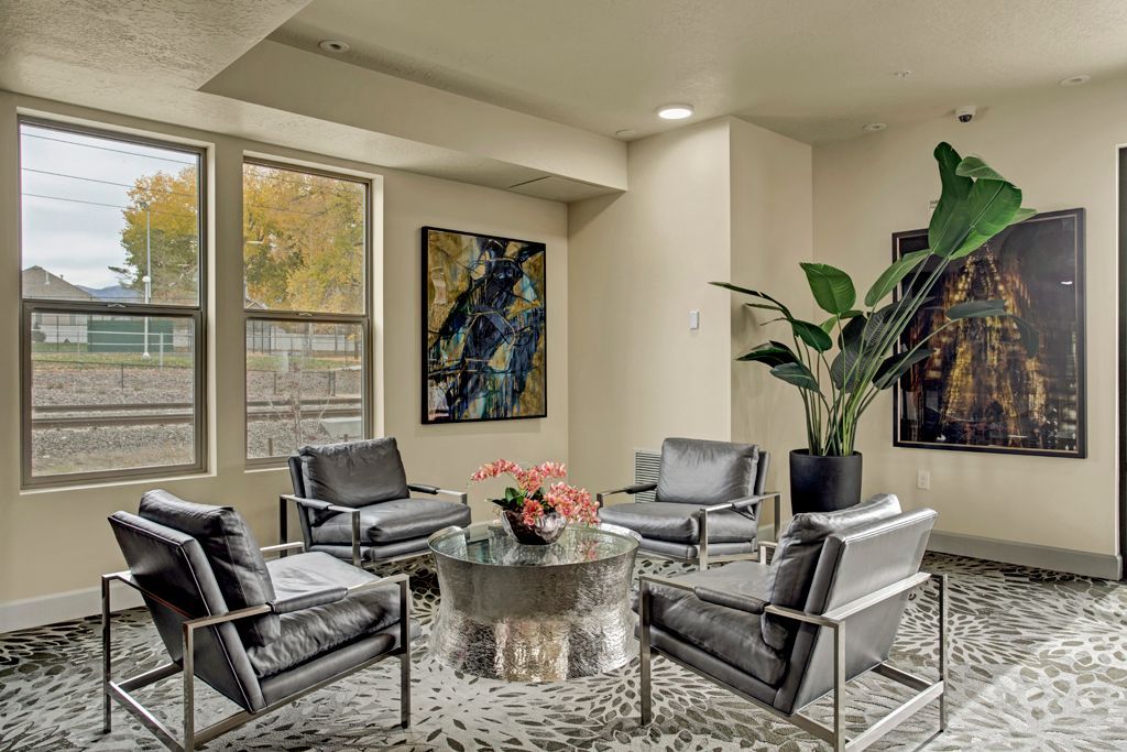 A living room filled with furniture and a table.