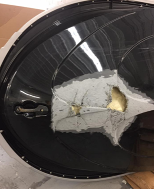 A black and white object with a hole in it