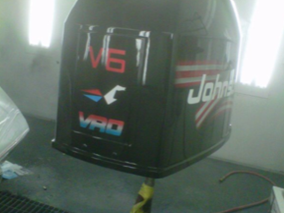 A john 's boat engine is sitting in a room