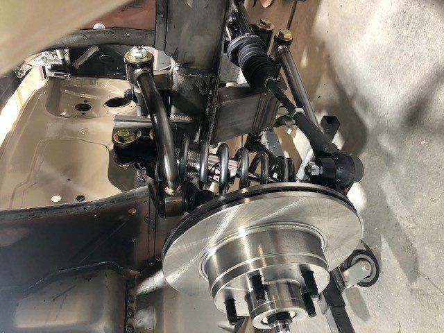 A close up of a brake disc on a car.