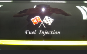 A sign that says fuel injection on it