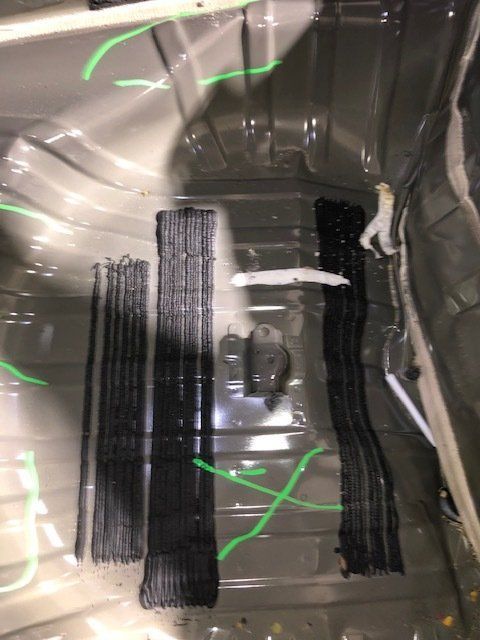 A close up of the inside of a car with green lines on it.