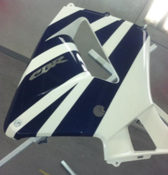 A blue and white motorcycle with the word cbr on it