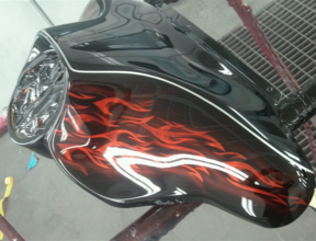 A black object with red flames painted on it