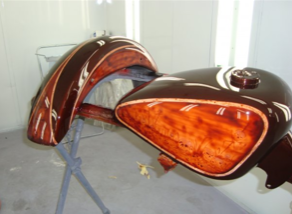 A brown motorcycle is sitting on a stand