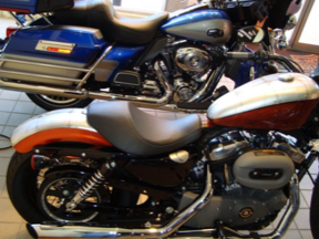 Two harley davidson motorcycles are parked next to each other