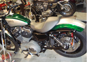 A harley davidson motorcycle is parked in a garage