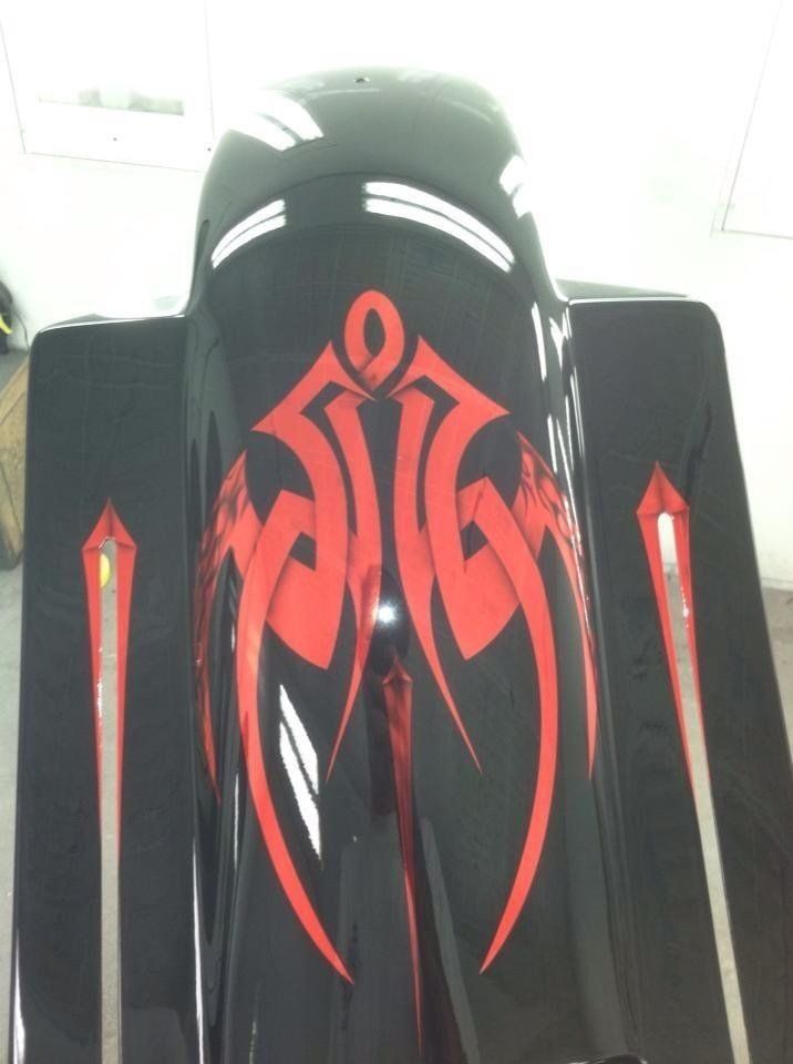 A black helmet with a red design on it