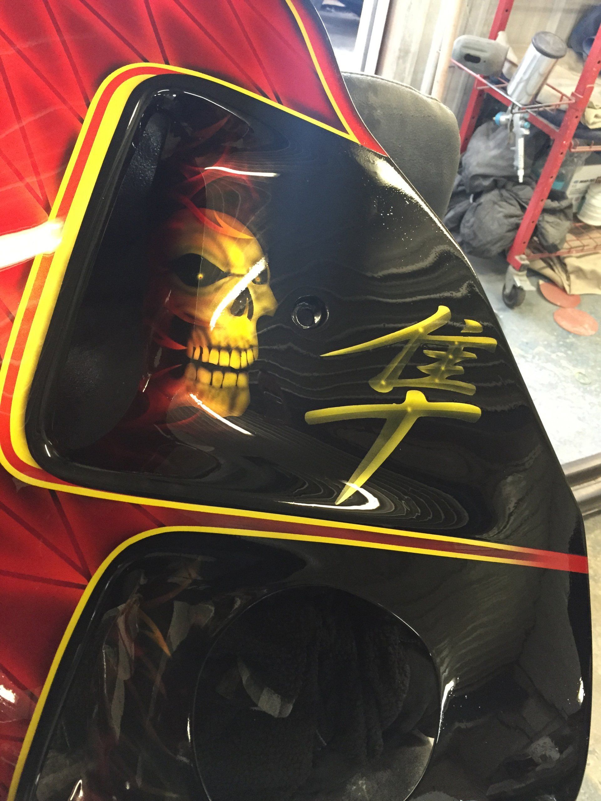 A skull is painted on the side of a car