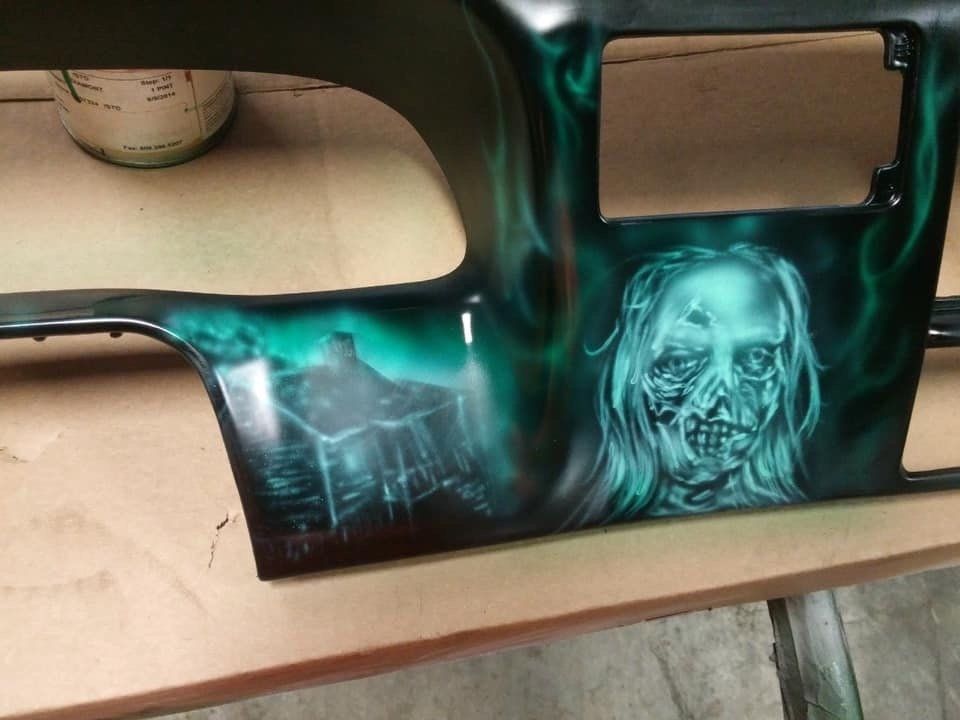 A dashboard with a picture of a zombie on it