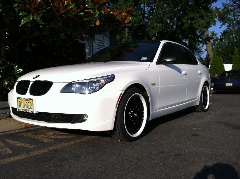 A white car with a new jersey license plate