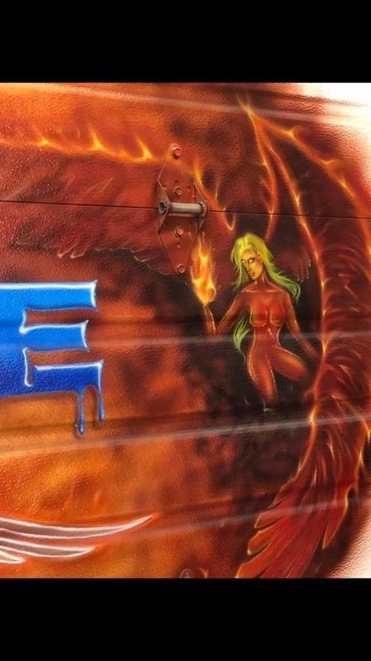 A painting of a woman holding a torch in front of a dragon.