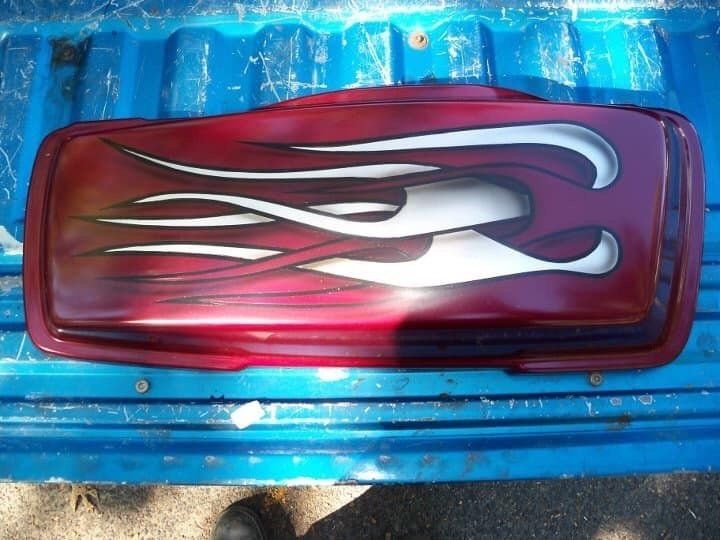 A red item with white flames painted on it